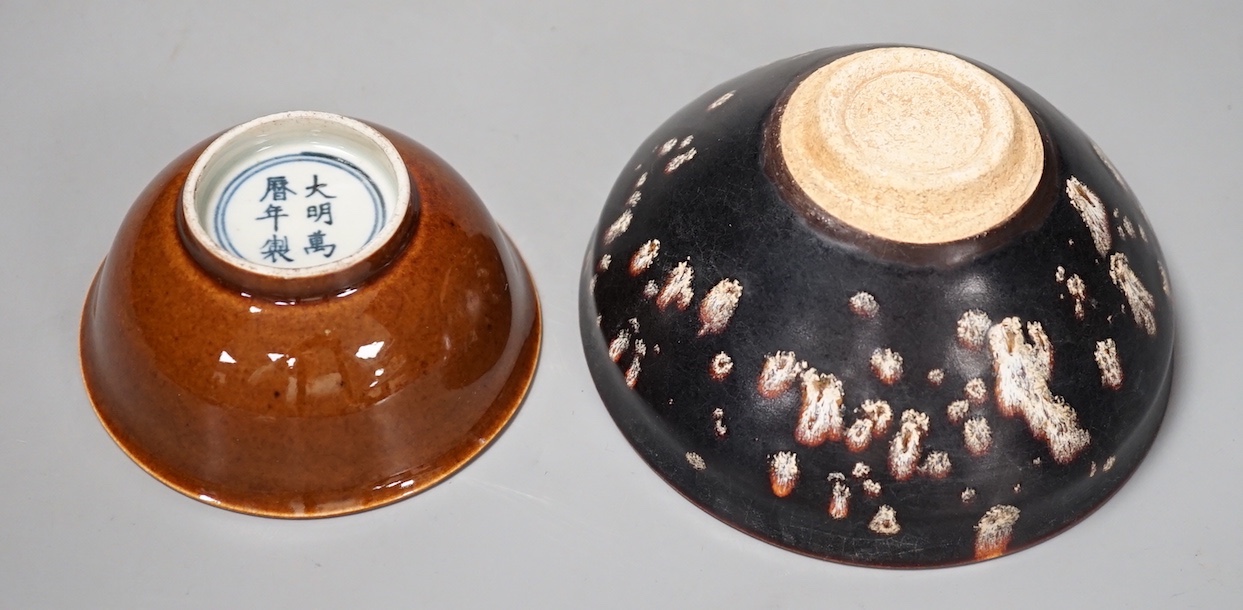 A Chinese brown glazed bowl and a Jian type papercut bowl (2)